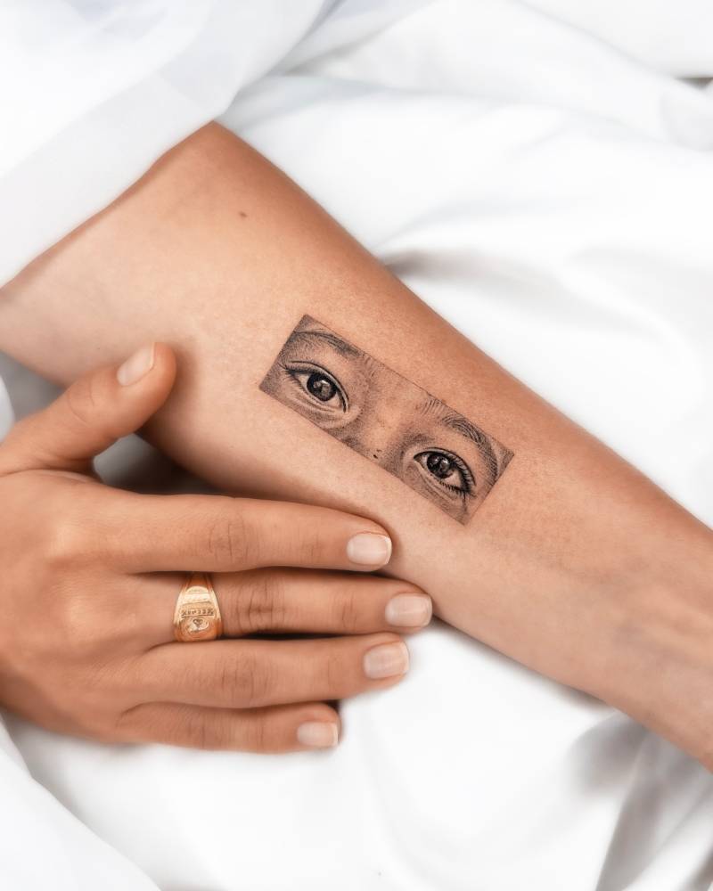 Micro-realistic style eyes tattoo placed on the inner forearm.