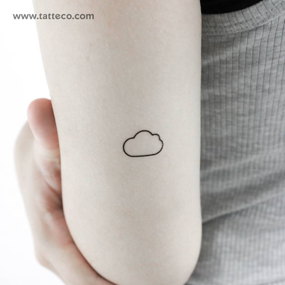 Minimalistic style cloud temporary tattoo located on the tricep.