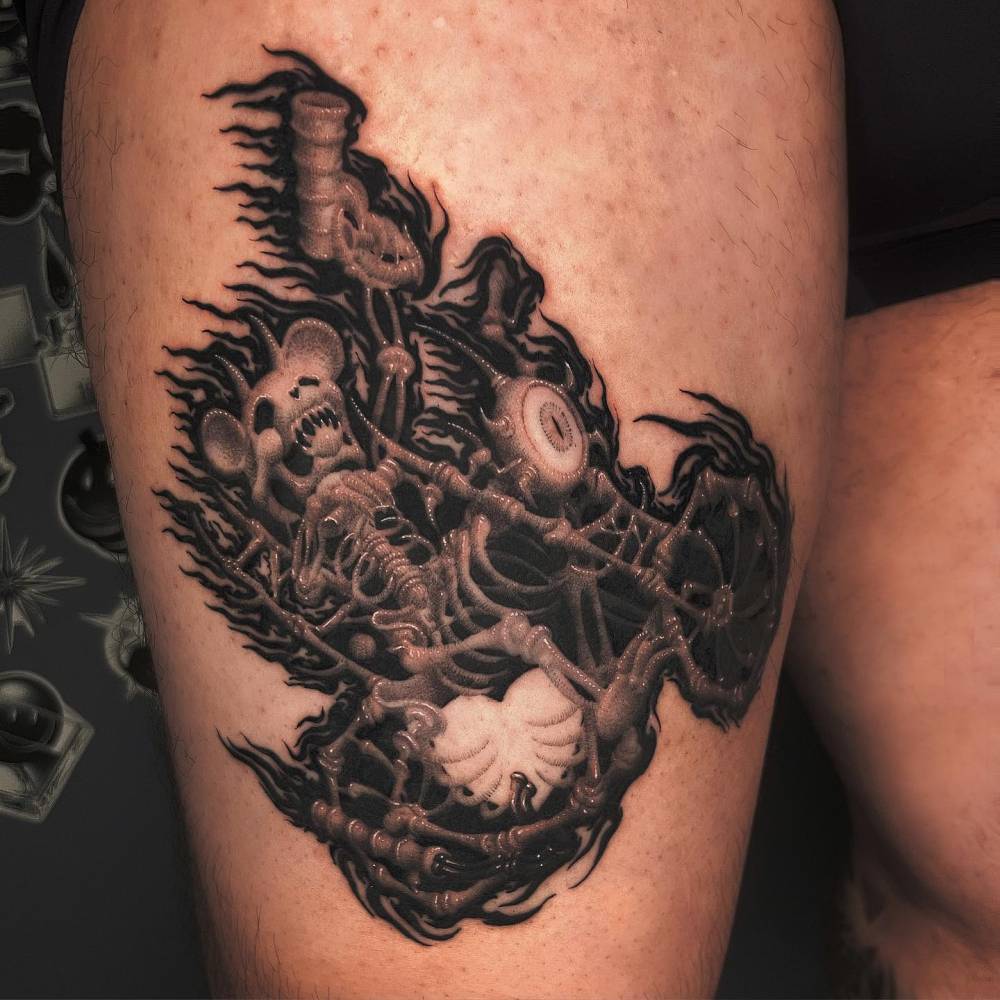 Skeleton bear riding a motorbike tattooed on the thigh.