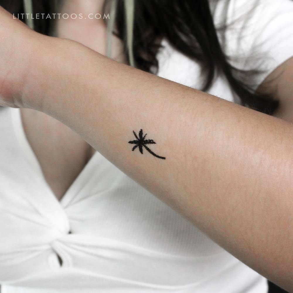 Coconut tree temporary tattoo located on the wrist.