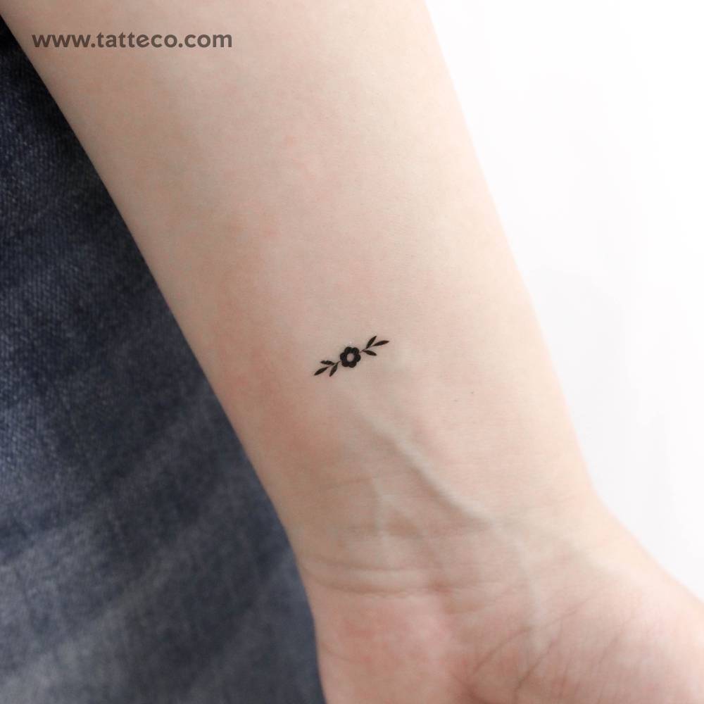 Minimal flower ornament temporary tattoo.
