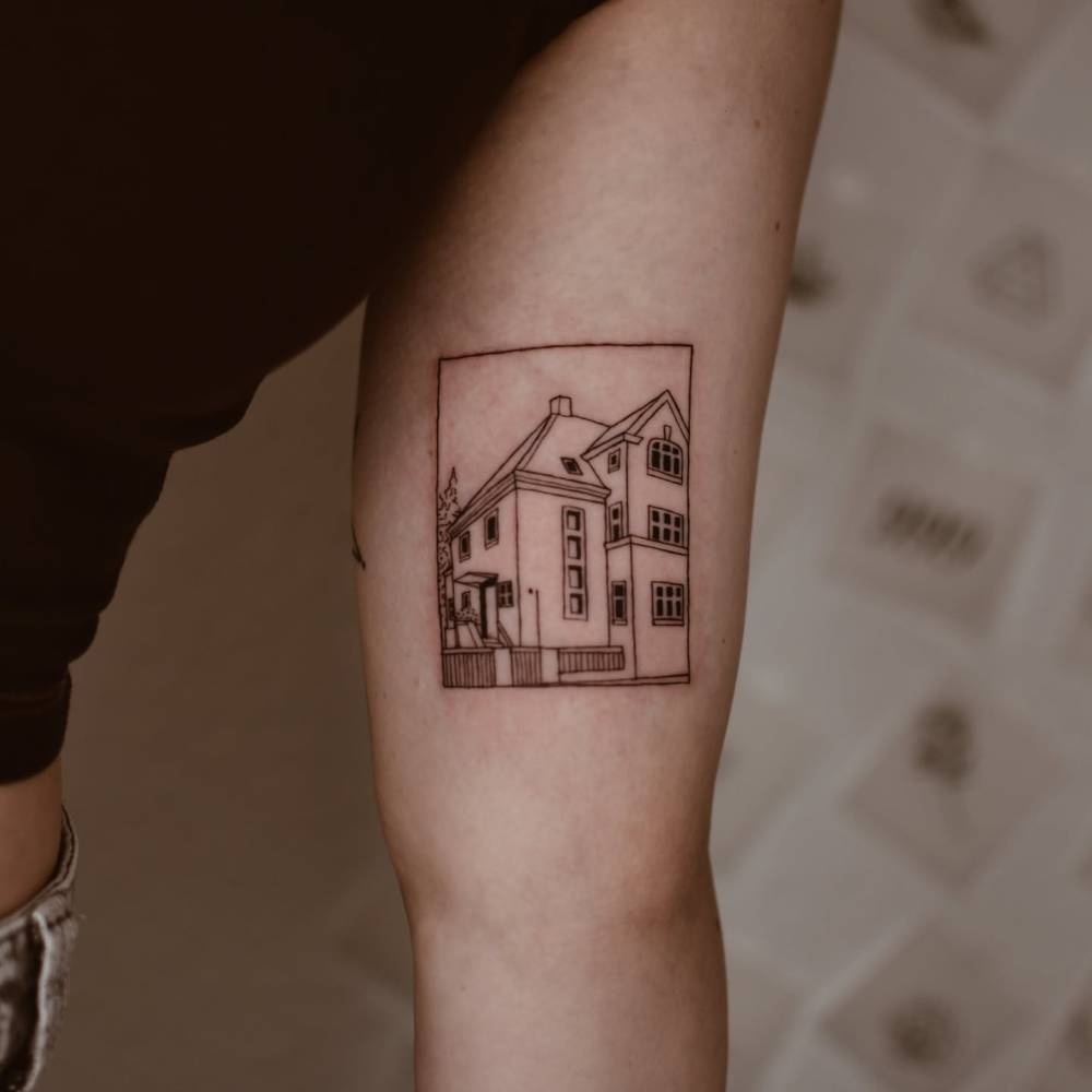 House tattoo tattoo in illustrative style placed on the inner arm.