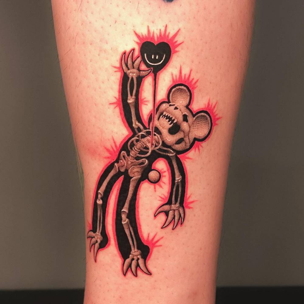 X-ray teddy bear tattoo in pop art style located on the shin.