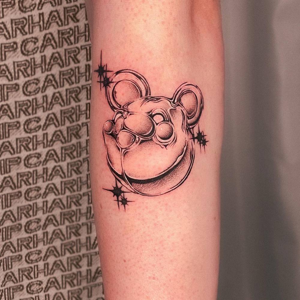 Metallic effect teddy bear portrait tattoo located on the