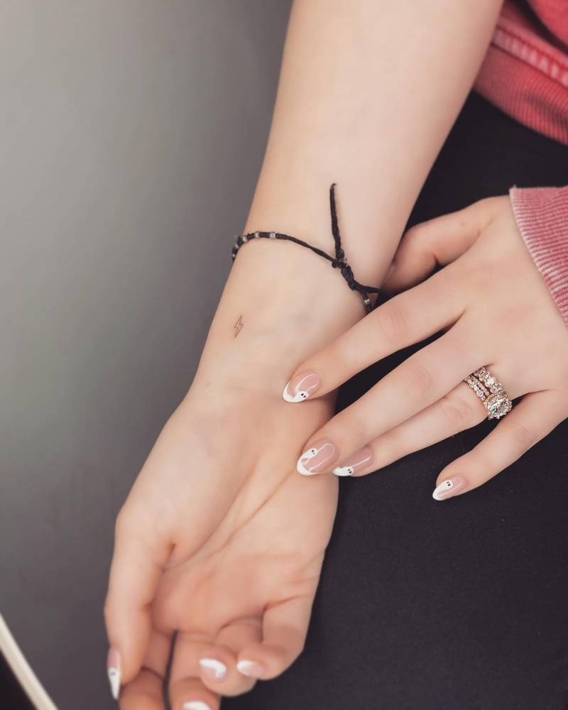 Micro lightning bolt tattoo done on the wrist.