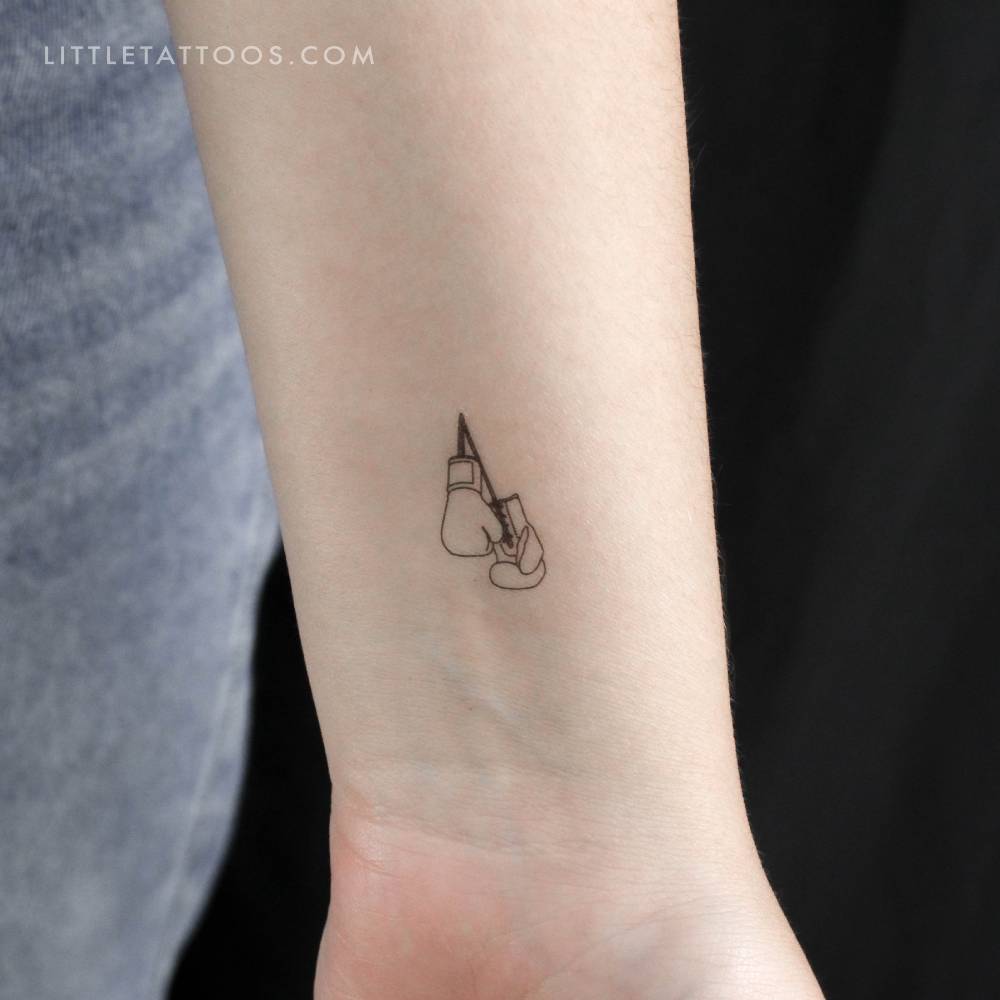 Boxing gloves temporary tattoo located on the wrist.