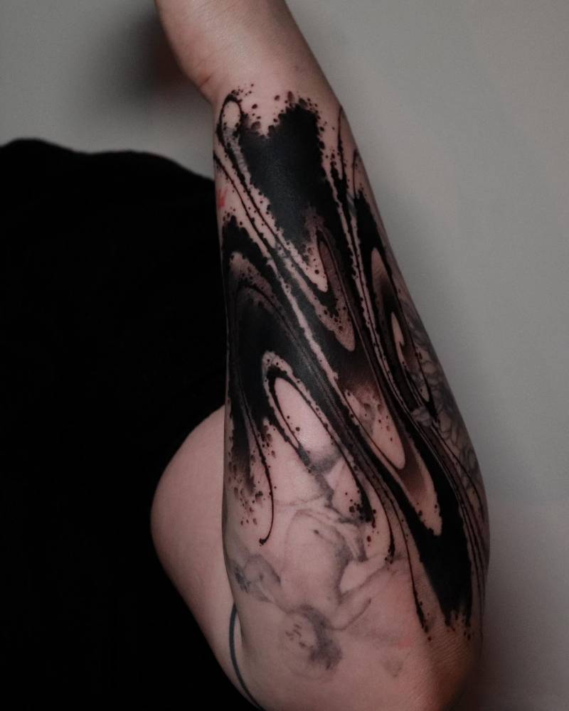 Abstract cover up flow tattoo in blackwork style.