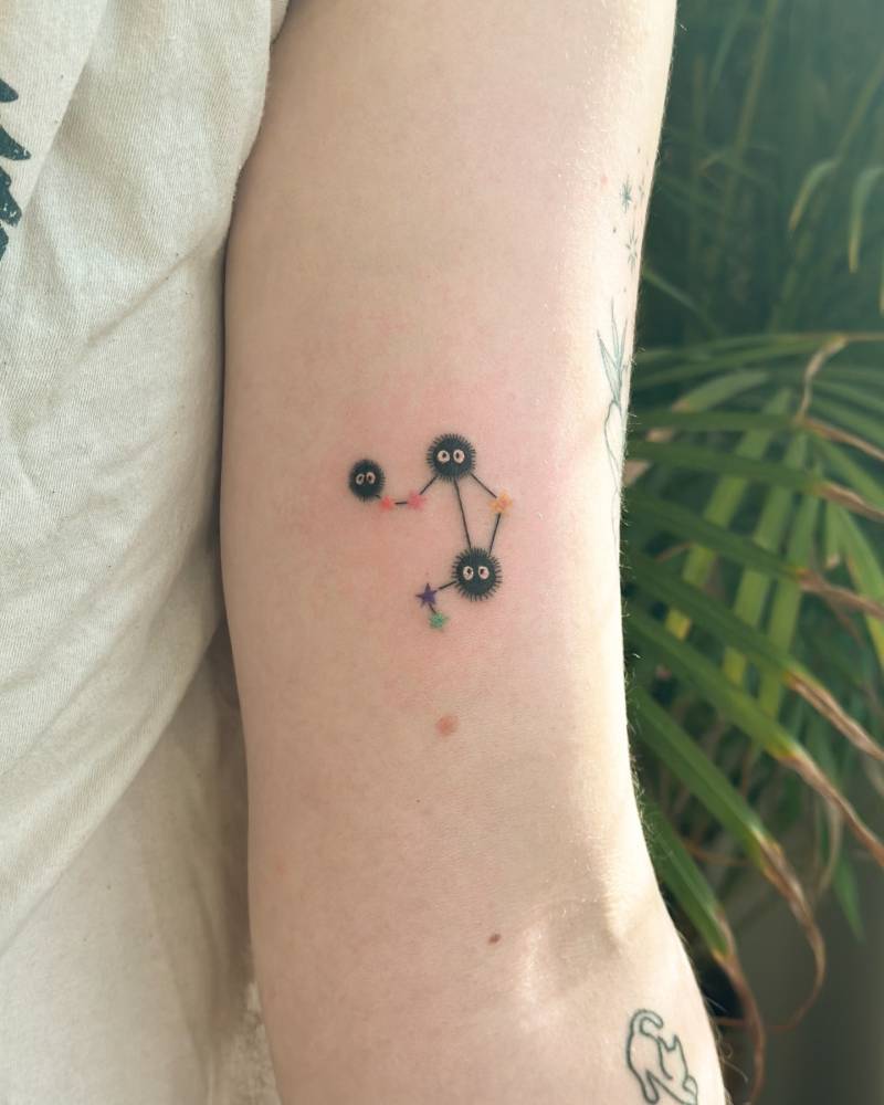 Soot Sprites and Libra constellation tattoo located on the inner arm.