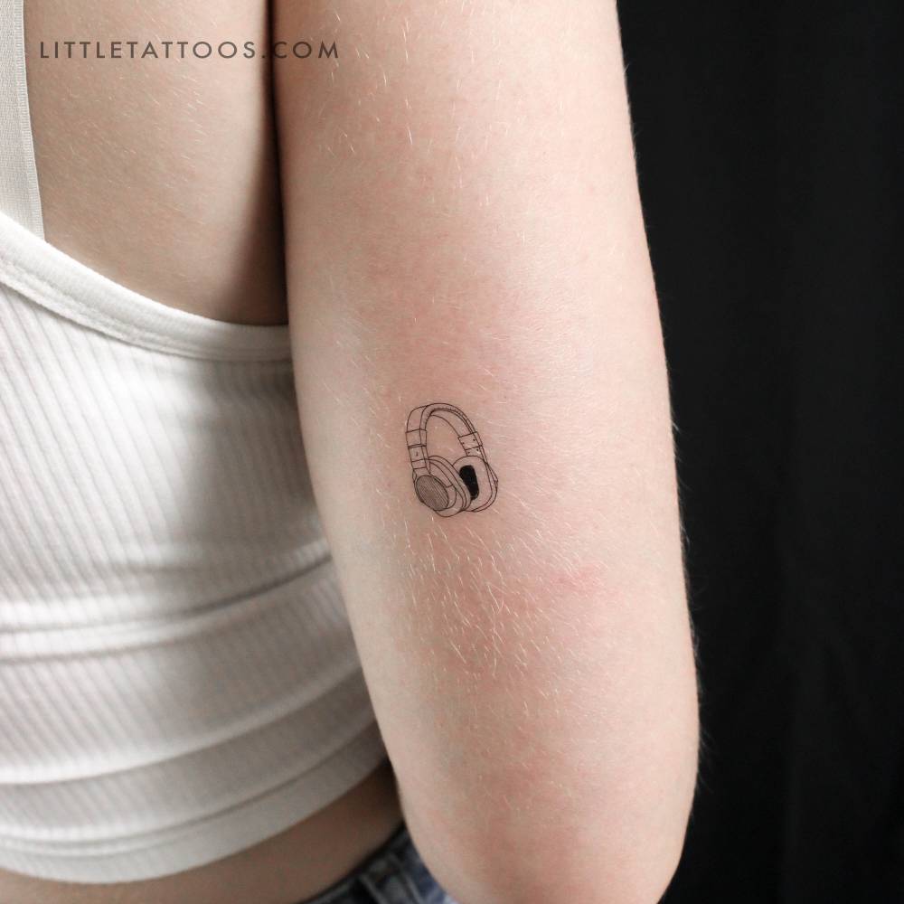 Headphones temporary tattoo located on the tricep.