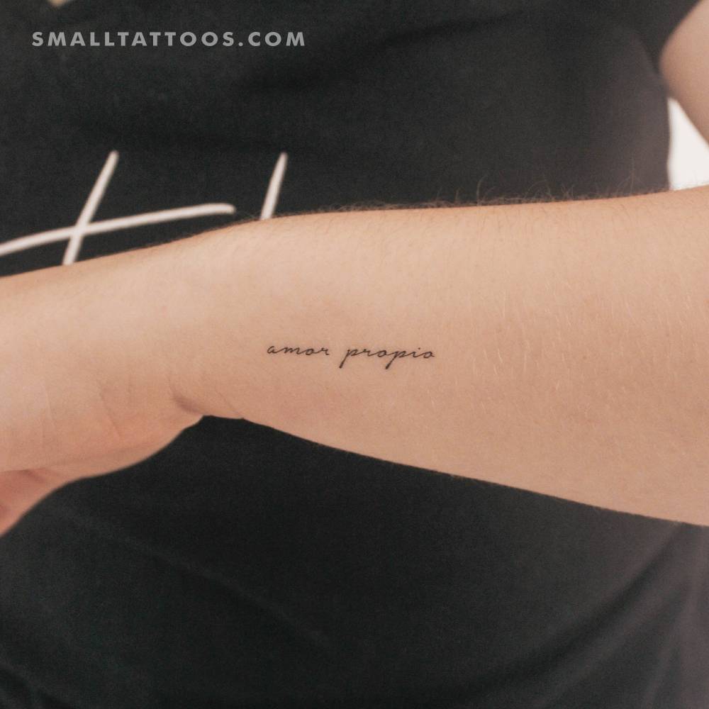 Handwritten font "amor propio" temporary tattoo located on the wrist.