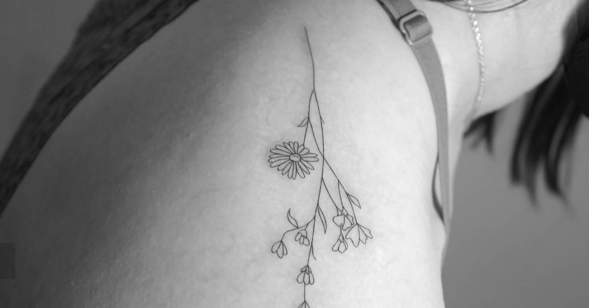Flower bouquet tattoo in fine line style located on the