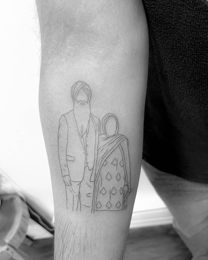 Family portrait tattoo in fine line style located on the inner forearm.