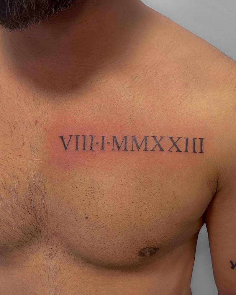 Date in roman numerals tattooed on the chest.