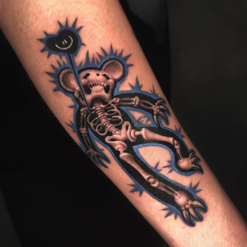 X-ray teddy bear tattoo done on the forearm.