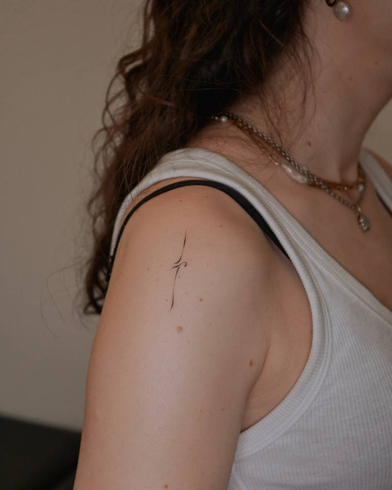 Ornamental design tattooed on the shoulder.