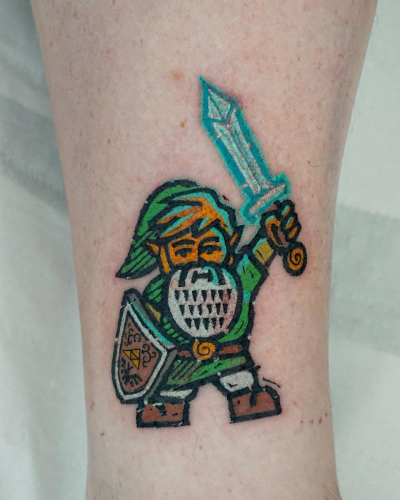 Link gnome tattoo in pop art style located on the ankle.