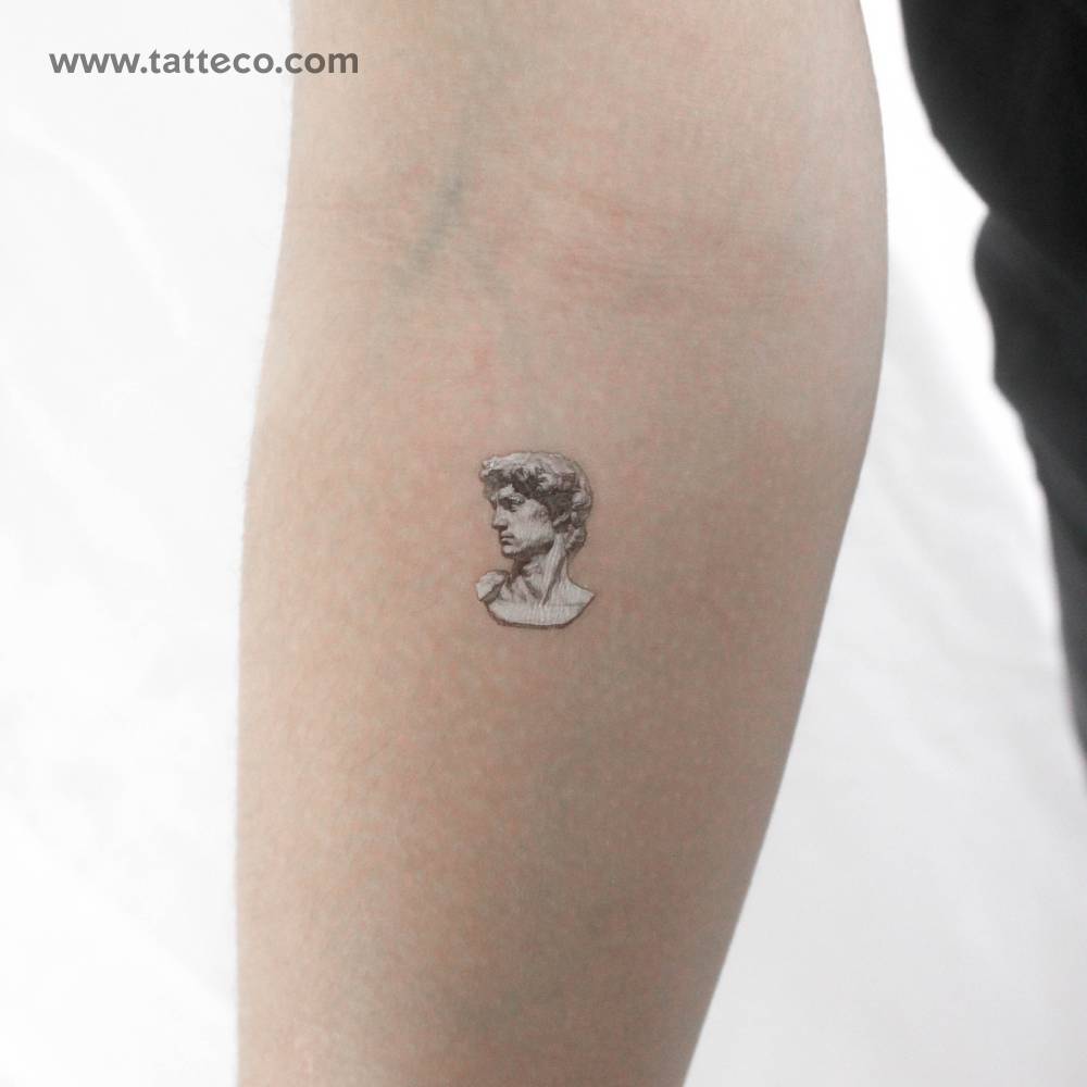 Michelangelo's David head temporary tattoo located on the inner forearm.