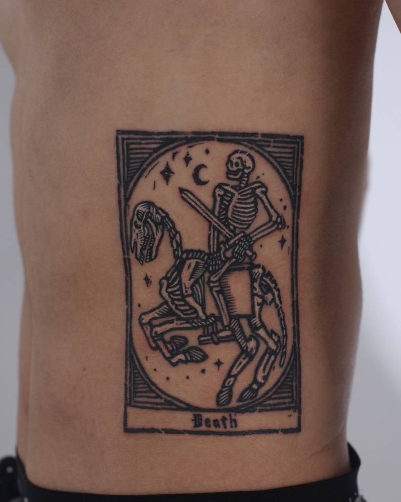 Death tarot card tattooed on the rib, engraving style.