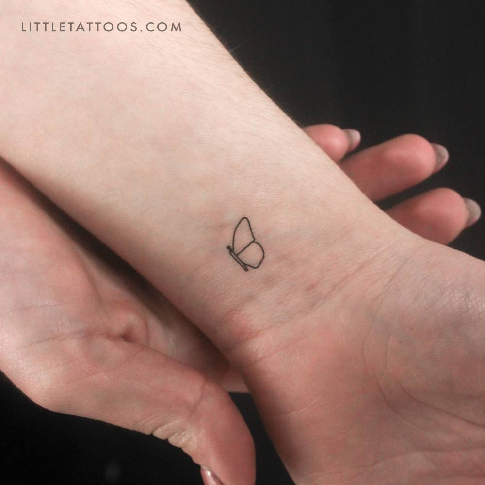 Right butterfly wing temporary tattoo located on the wrist.