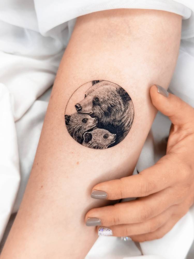 Bear family tattoo in micro-realistic style done on the inner forearm.