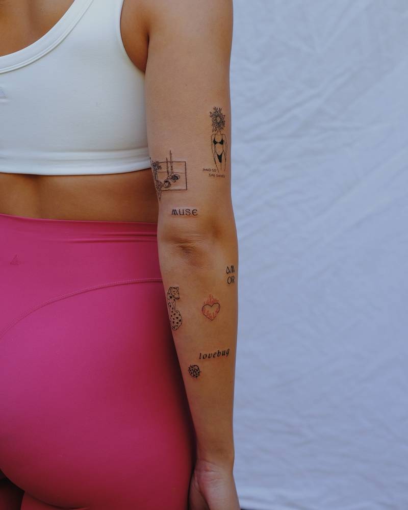 Arm composition tattoos in illustrative style.