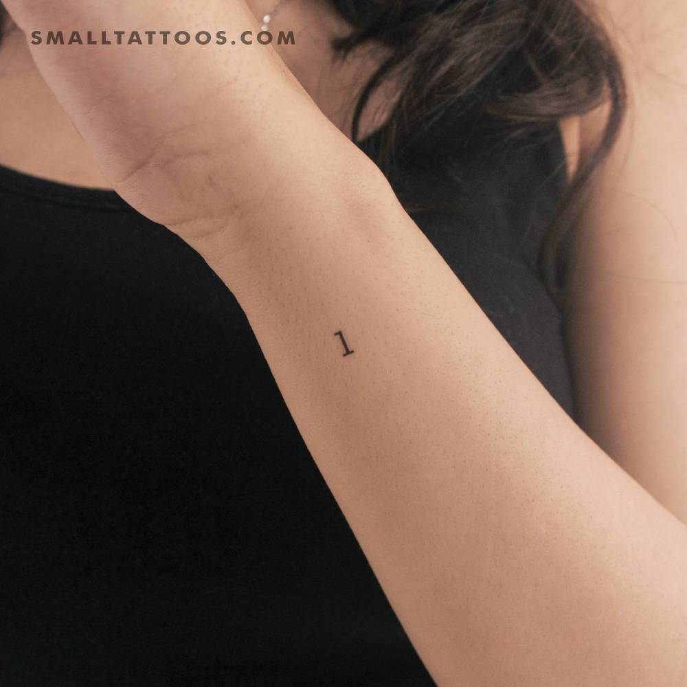 "L" lowercase typewriter letter temporary tattoo located on the wrist.