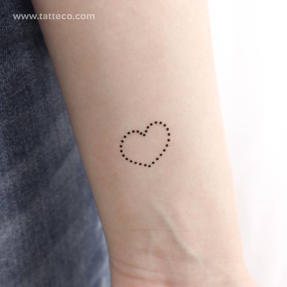 Dotted heart temporary tattoo placed on the wrist.