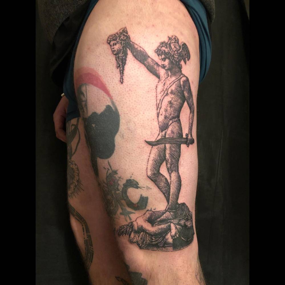 'Perseus with the Head of Medusa' tattoo located on the thigh.