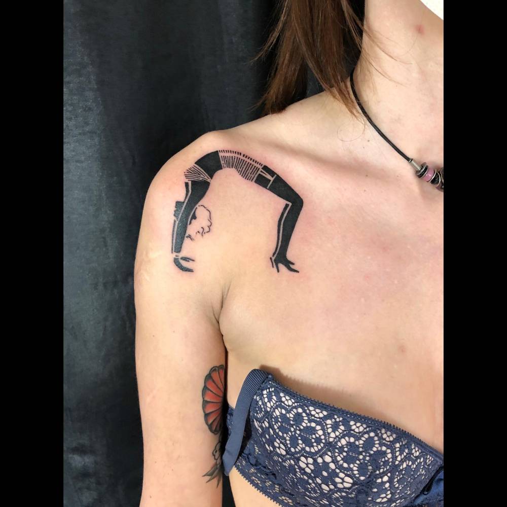 Blackwork style Yogini tattoo located on the shoulder.