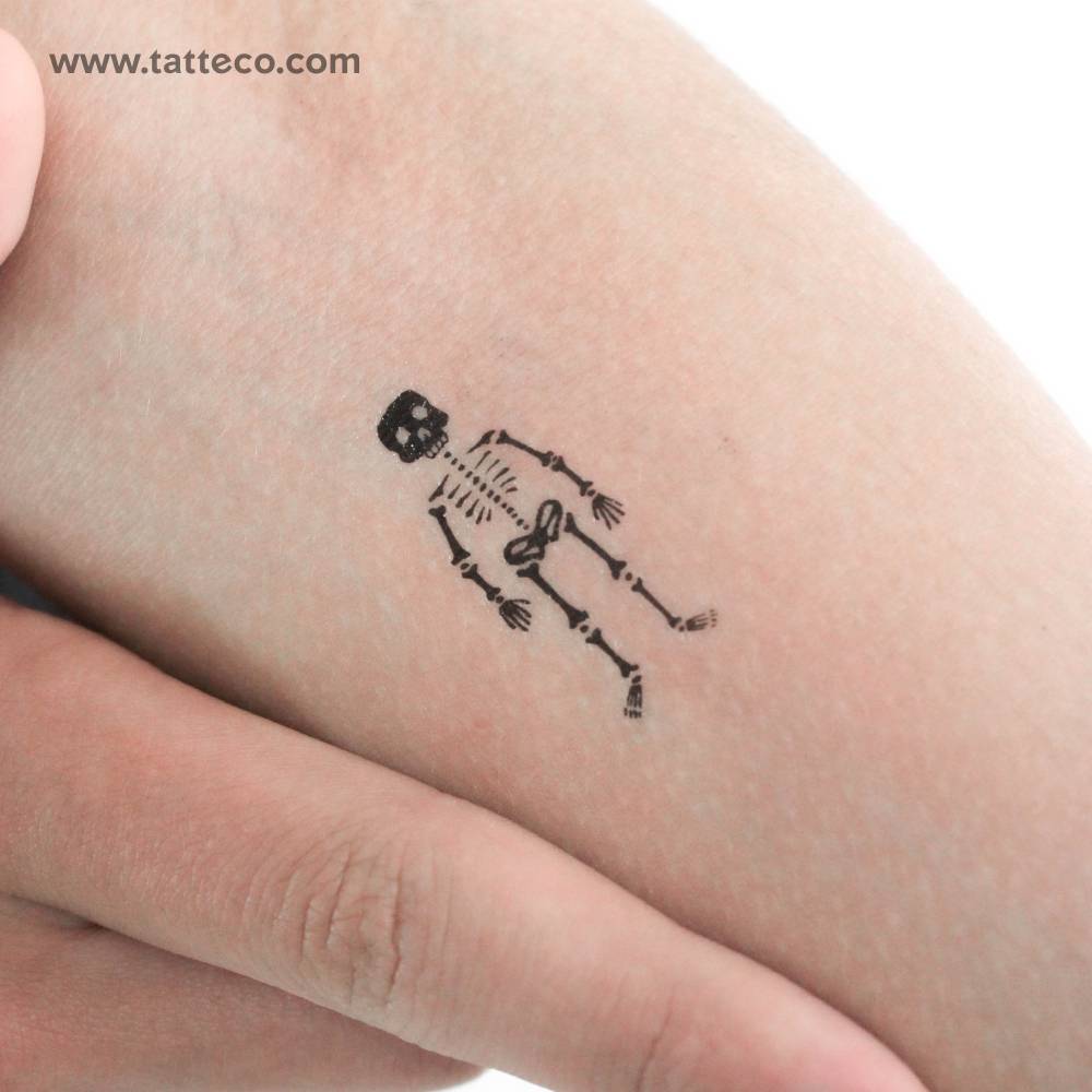 Skeleton temporary tattoo placed on the inner forearm.