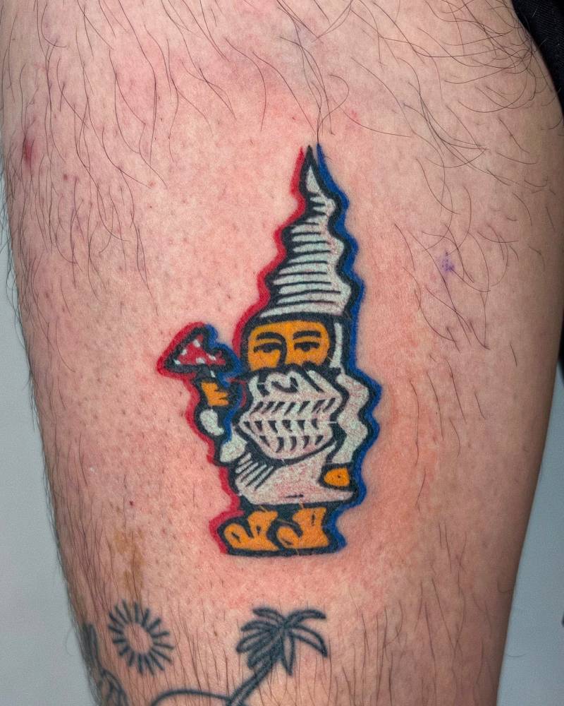 Pop art style gnome tattoo located on the thigh.