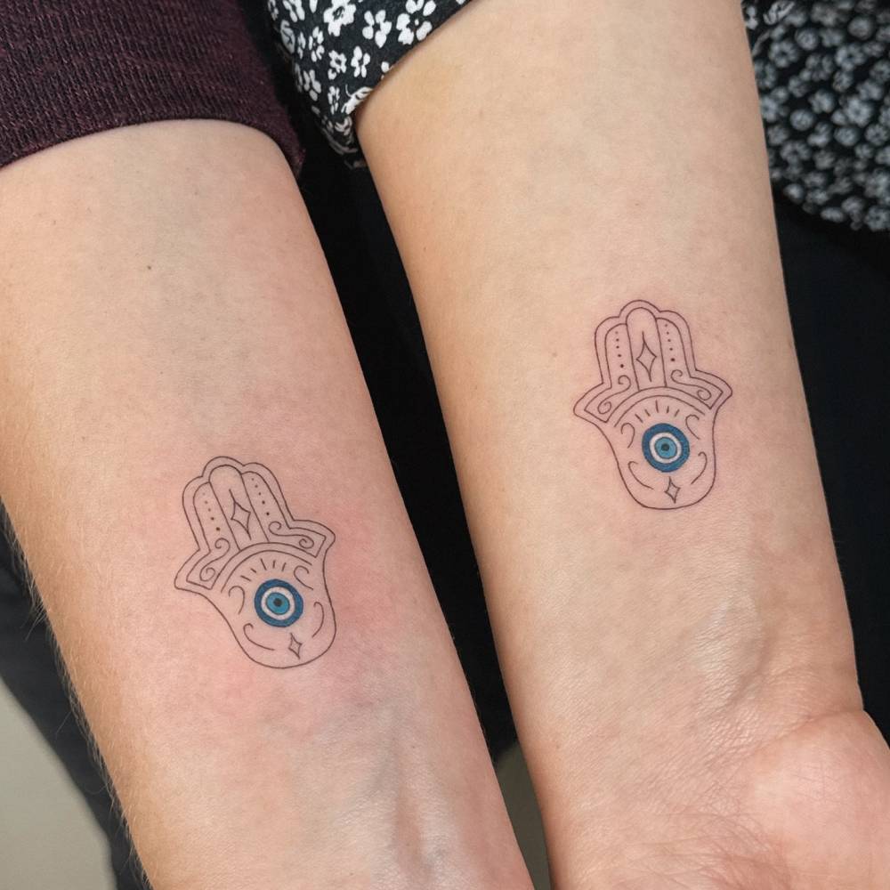 Matching hamsa tattoo for best friends.