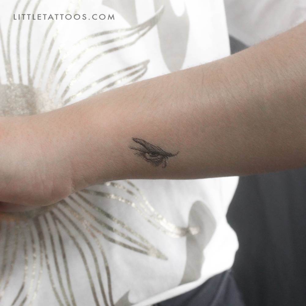 Small Fallen Angel's crying eye temporary tattoo located on the wrist.