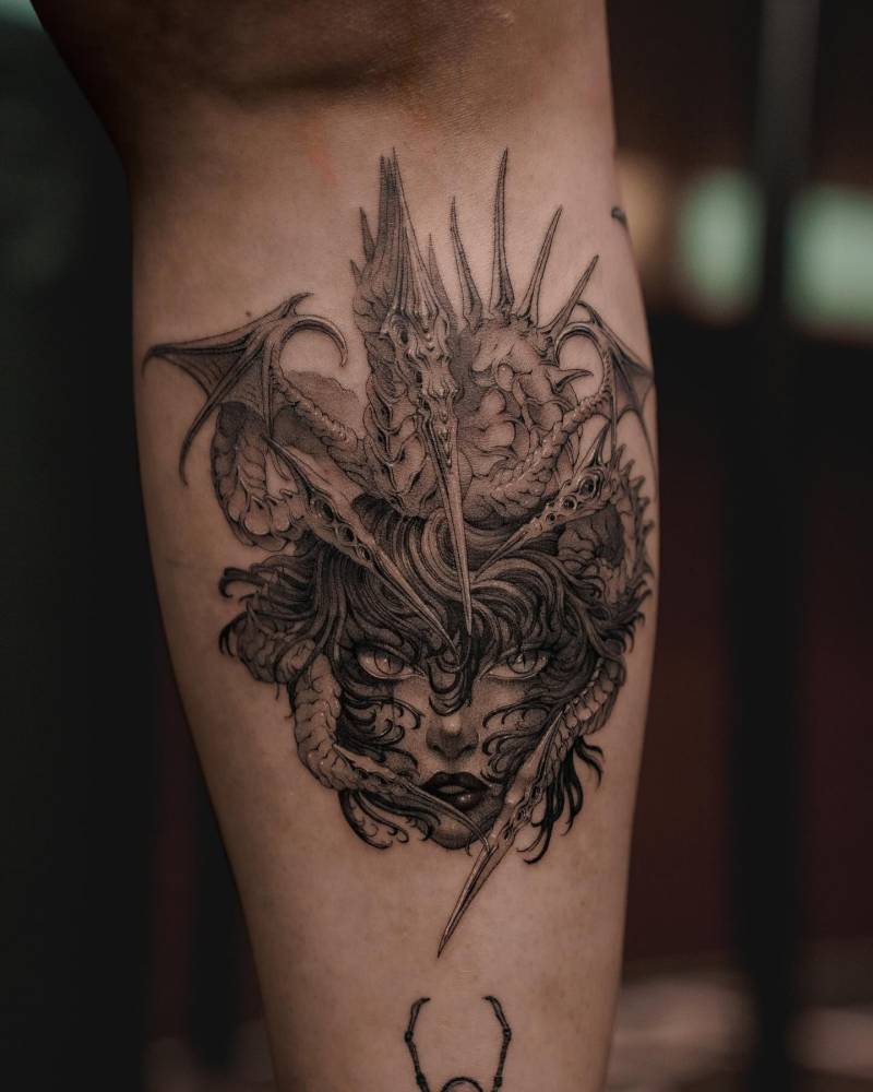 Comic style Medusa portrait tattoo located on the shin.