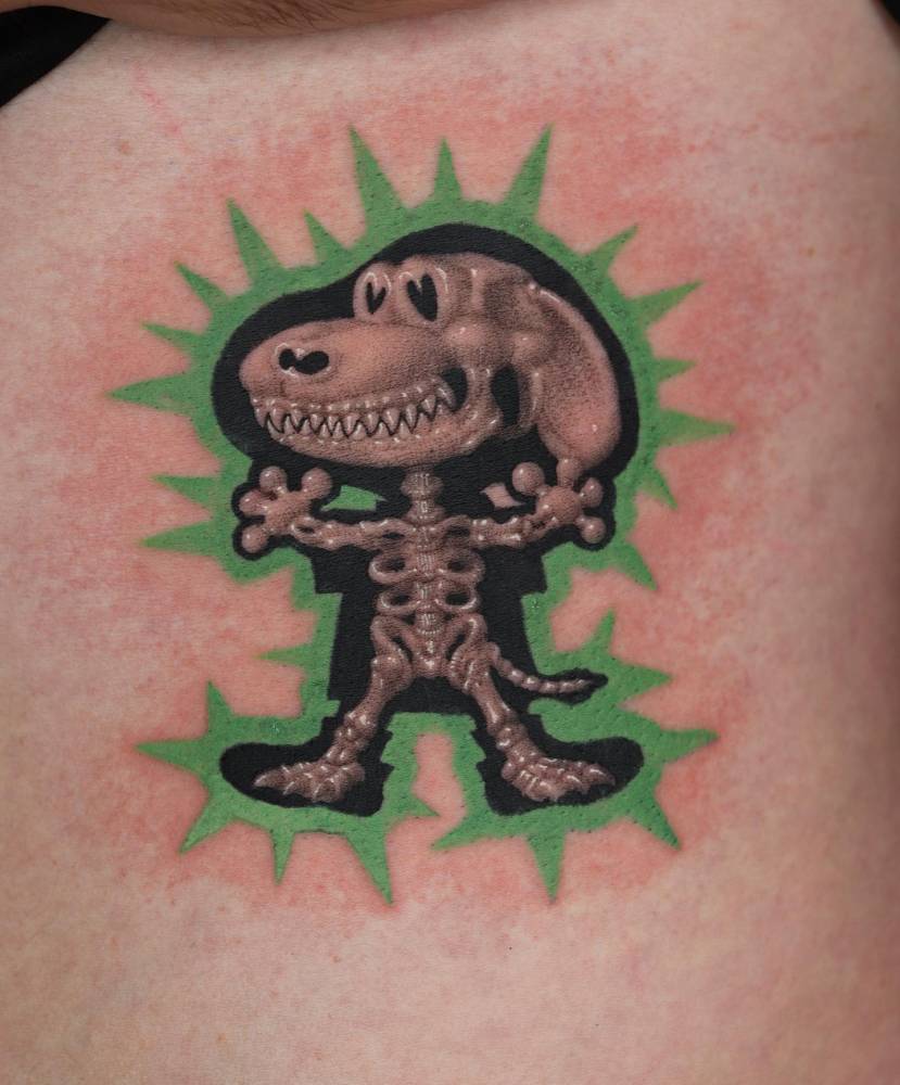 Snoopy x-ray tattoo located on the waist, cartoon style.