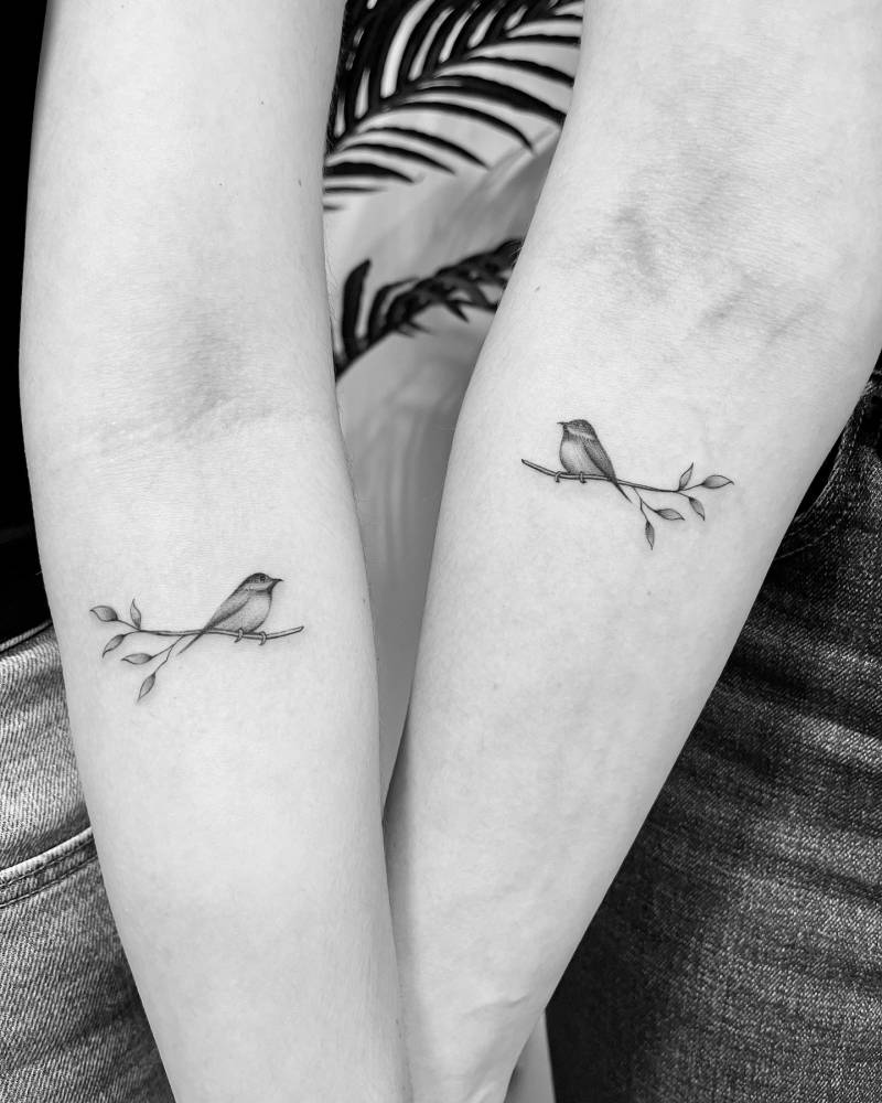 Matching bird on a branch tattoo for best friends.