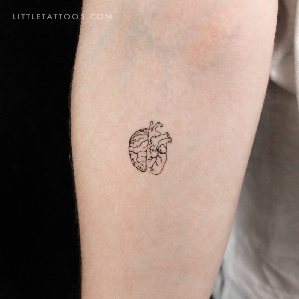 Half heart half brain temporary tattoo located on the inner forearm.