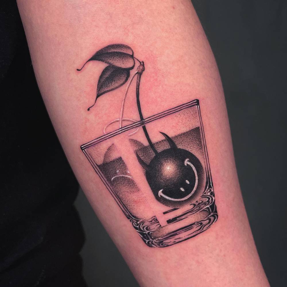 Cherry cocktail tattoo located on the inner forearm, dotwork style.