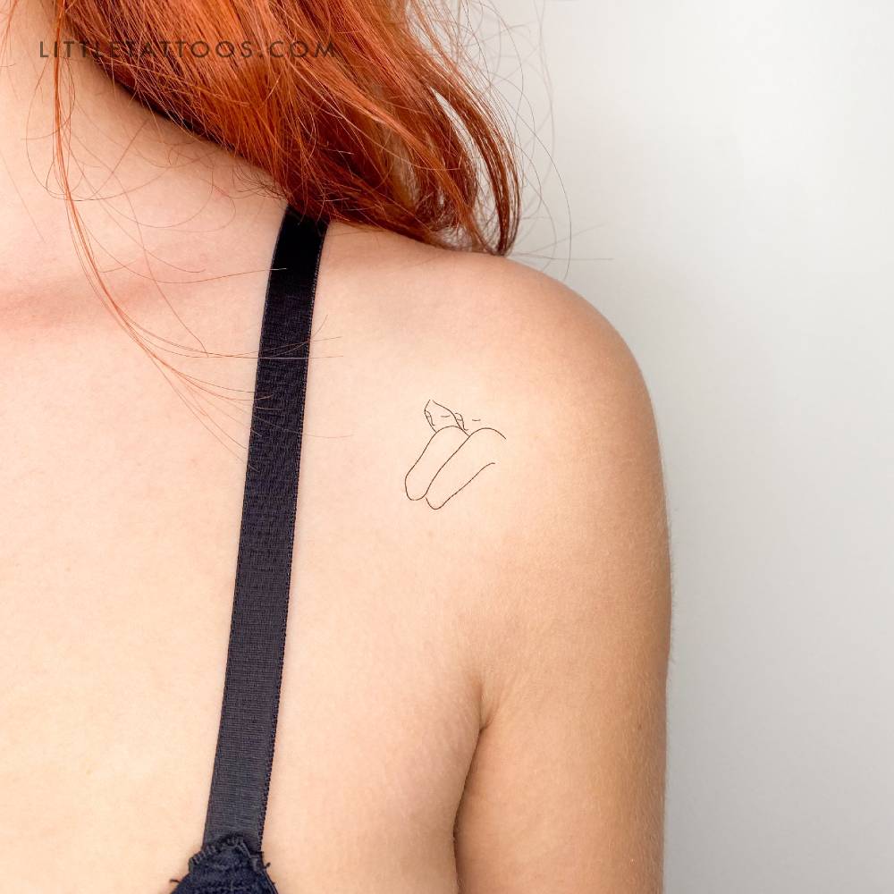 Soulmate temporary tattoo in fine line style located on the shoulder.