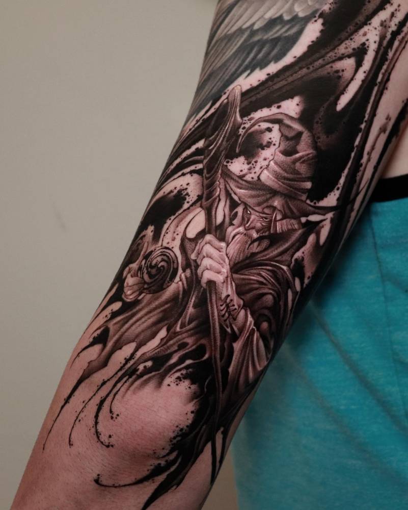Wizard flow tattooed on the tricep, comic style.