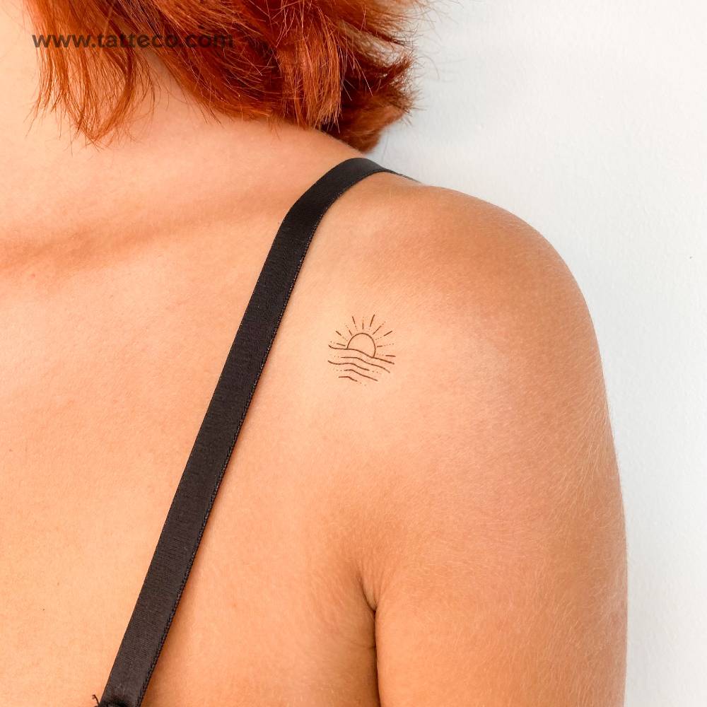 Small beach sunset temporary tattoo located on the shoulder.