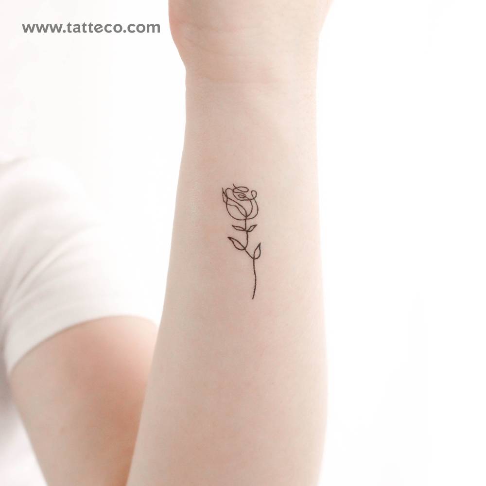 Single line rose temporary tattoo located on the wrist.