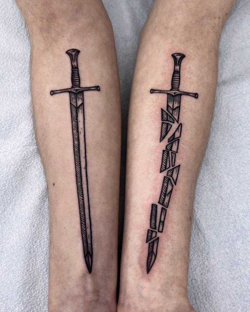 Individual matching sword and broken sword tattooed on the inner forearms.