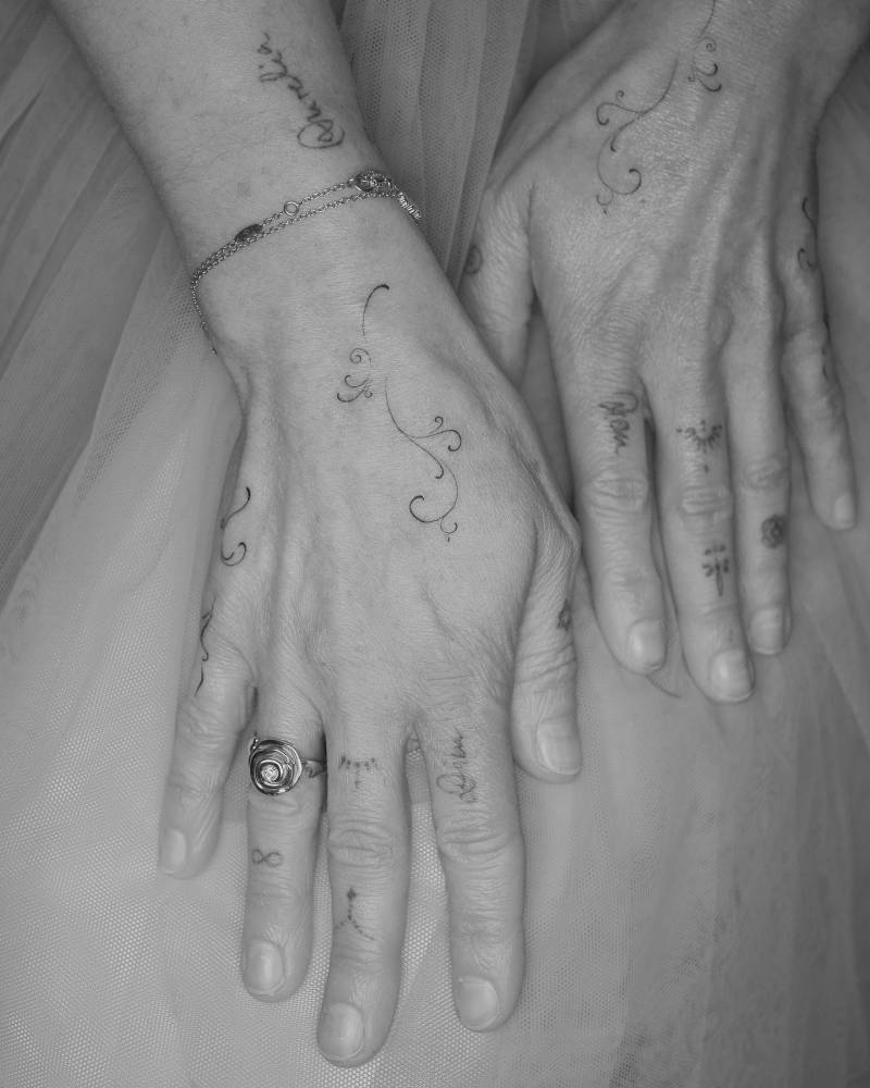 Ornamental hand composition tattoos in fine line style.