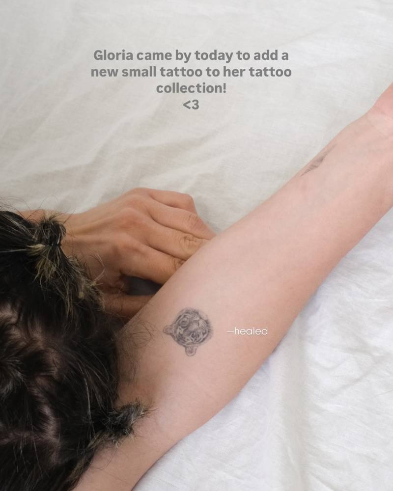 Healed tiger portrait tattoo in micro-realistic style.