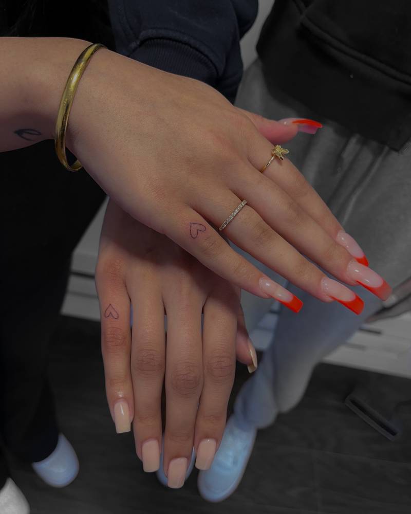 Tiny matching minimalistic heart tattoo for best friends.