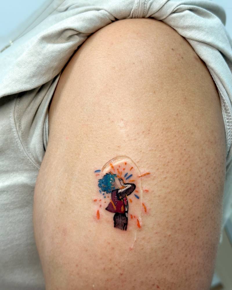 Watercolor style Sophie Hatter tattoo located on the upper arm.