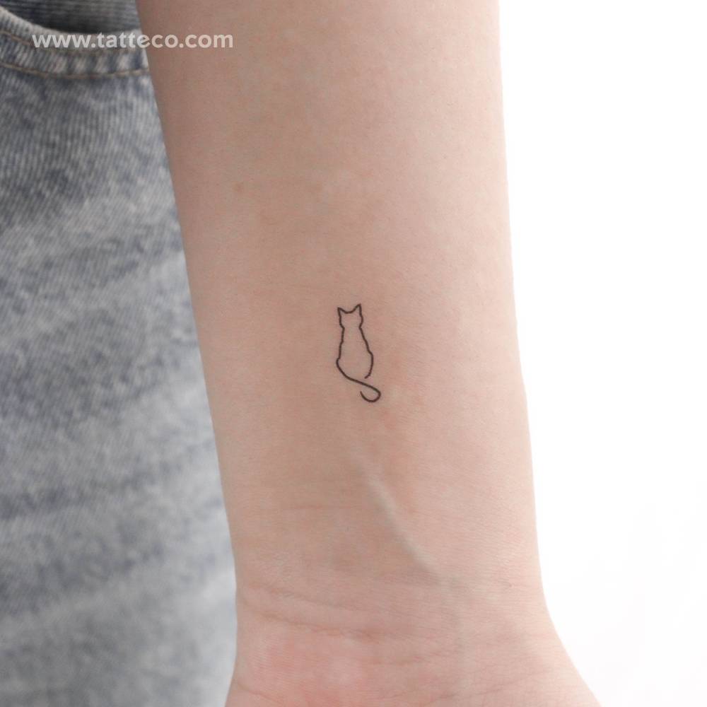 Line art cat temporary tattoo done on the wrist.