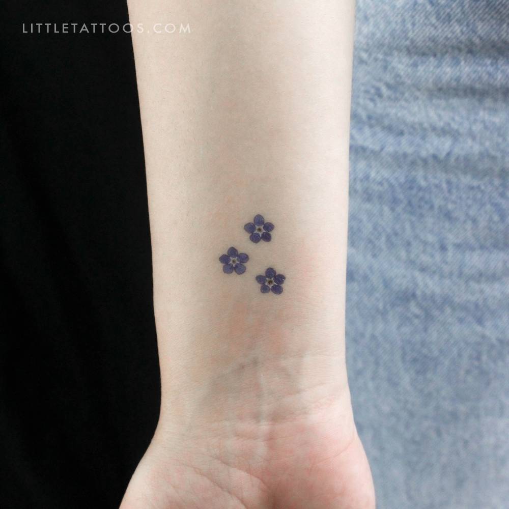 Three forget-me-not flowers temporary tattoo located on the wrist.