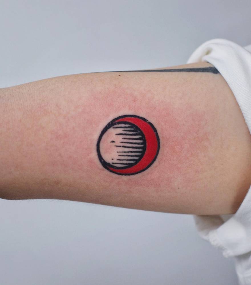 Engraving style crescent moon tattoo placed on the inner arm.